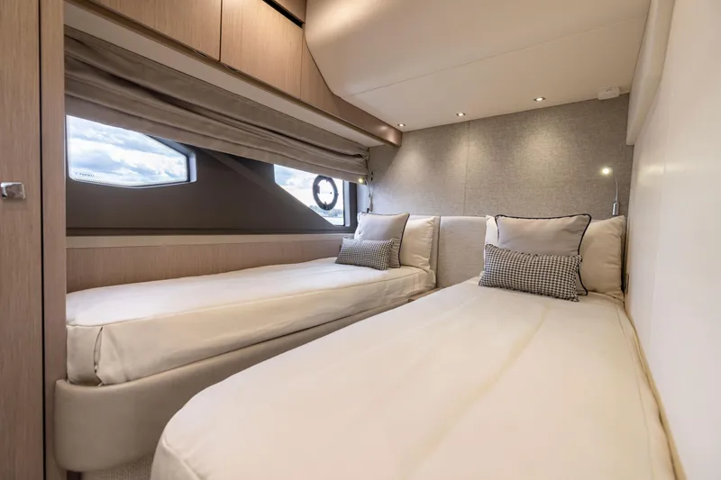 Slide: The Image of Luxurious interior of 2018 Sunseeker Manhattan 52 yacht with twin beds and elegant decor. - 47