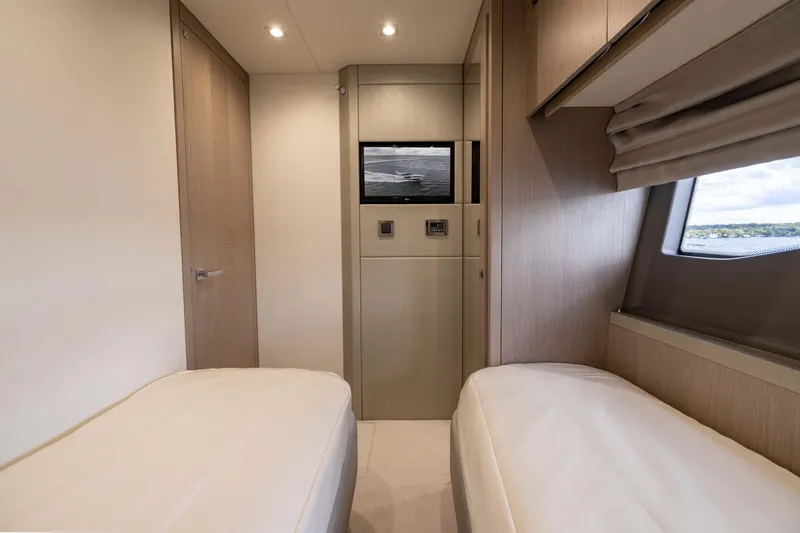 Slide: The Image of Luxurious cabin interior of 2018 Sunseeker Manhattan 52 yacht with twin beds. - 49
