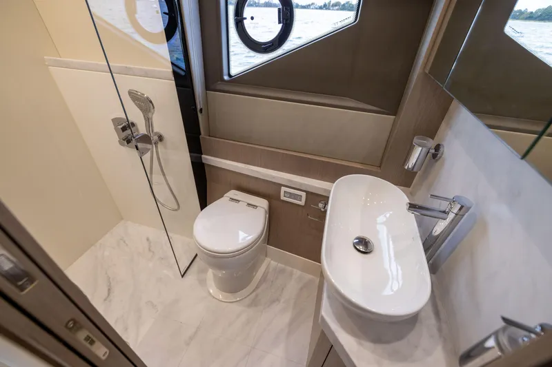 Slide: The Image of Luxurious bathroom in 2018 Sunseeker Manhattan 52 yacht with modern fixtures and ocean view. - 51