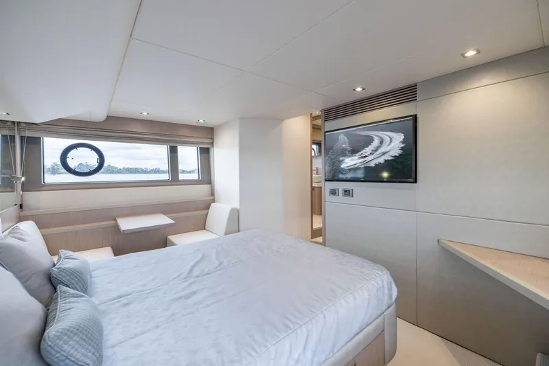 Slide: The Image of Luxurious interior of 2018 Sunseeker Manhattan 52 yacht with modern bedroom and scenic window view. - 56