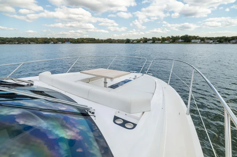 Slide: The Image of 2018 Sunseeker Manhattan 52 yacht with spacious deck and scenic water view. - 64