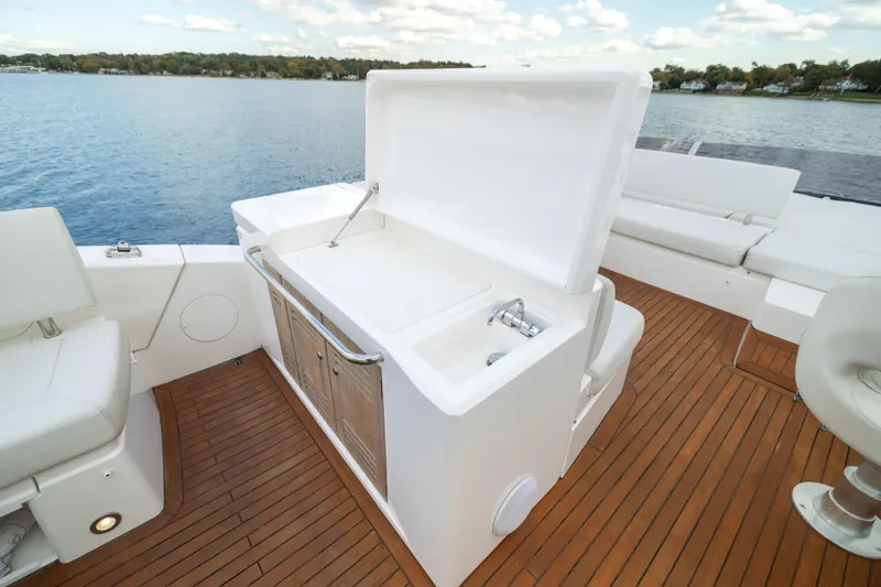 Slide: The Image of Luxurious 2018 Sunseeker Manhattan 52 yacht deck with open storage and seating. - 66