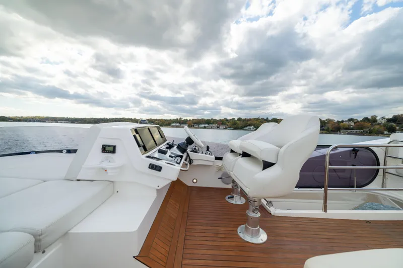 Slide: The Image of Luxurious 2018 Sunseeker Manhattan 52 yacht helm with scenic water view. - 69
