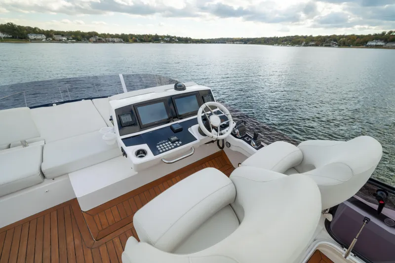 Slide: The Image of Flybridge of 2018 Sunseeker Manhattan 52 yacht with luxurious seating and control panel. - 72