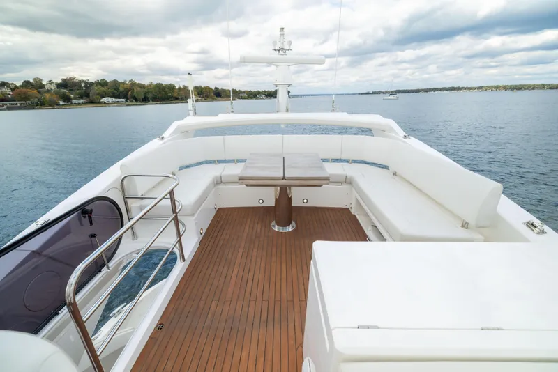 Slide: The Image of Flybridge of 2018 Sunseeker Manhattan 52 yacht with wooden deck and seating area. - 74