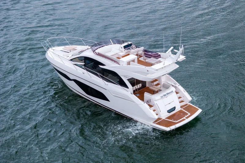 Slide: The Image of 2018 Sunseeker Manhattan 52 yacht cruising on open water, showcasing luxury design. - 8