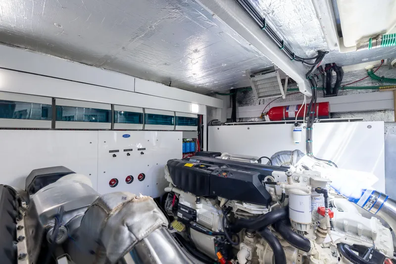 Slide: The Image of Engine room of 2018 Sunseeker Manhattan 52 yacht, featuring modern equipment and fire safety system. - 82