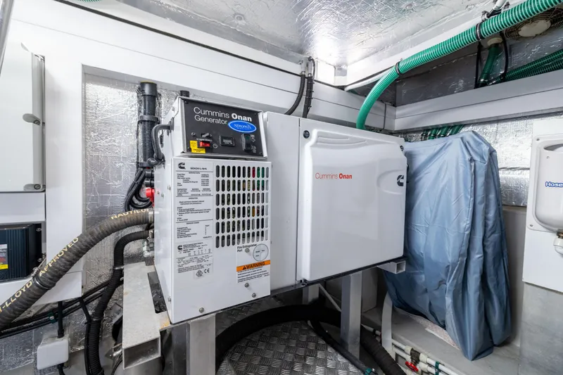 Slide: The Image of Engine room of 2018 Sunseeker Manhattan 52 with Cummins Onan generator. - 83