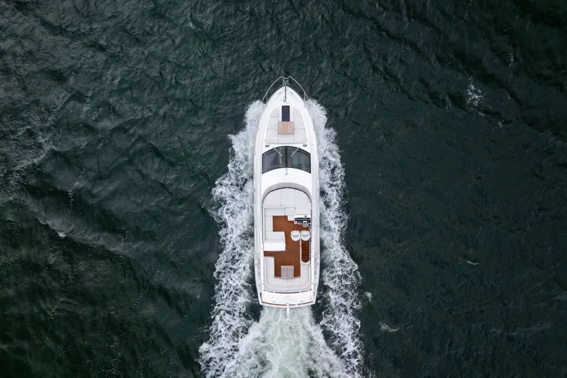 Slide: The Image of Aerial view of 2018 Sunseeker Manhattan 52 yacht cruising on open water. - 87
