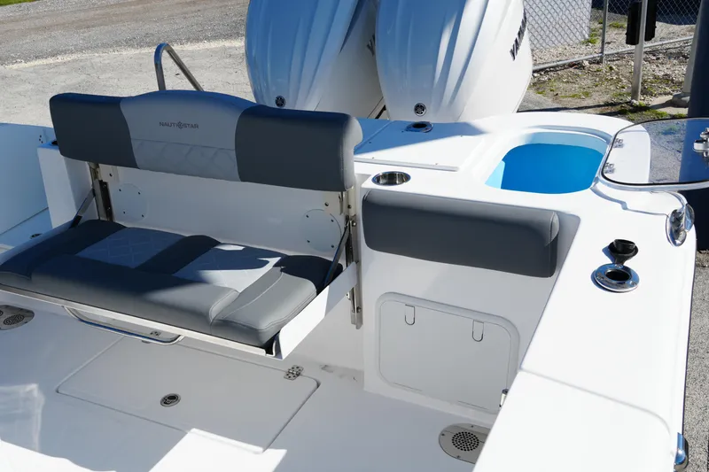 Slide: The Image of 2025 NauticStar 292 Legacy boat interior with seating and storage compartments. - 31