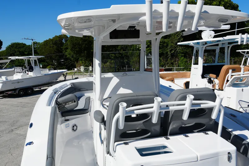 Slide: The Image of 2025 NauticStar 292 Legacy boat with sleek design and modern features, docked outdoors. - 35