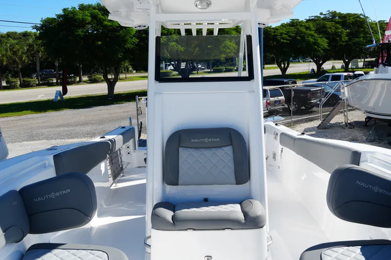 Slide: The Image of 2025 NauticStar 292 Legacy boat interior with gray seating and modern design. - 40