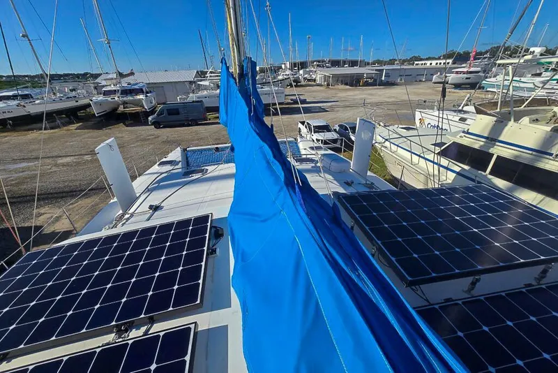 Slide: The Image of Sailboat with solar panels in a marina, Dolphin 460 model, 2006. - 18