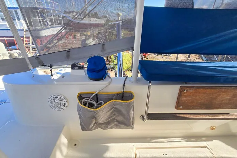 Slide: The Image of Deck of a 2006 Dolphin 460 yacht with seating and storage. - 27