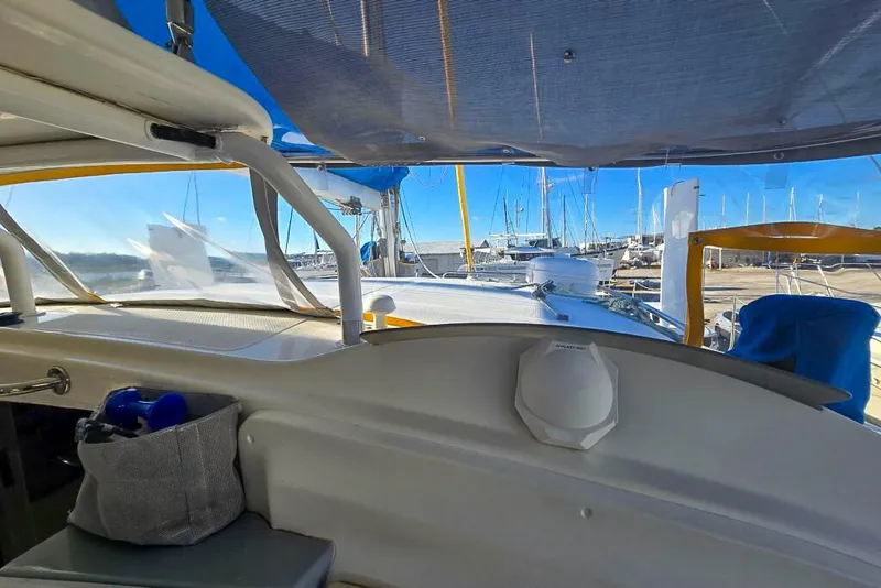 Slide: The Image of Interior view of a 2006 Dolphin 460 sailboat docked at a marina. - 34