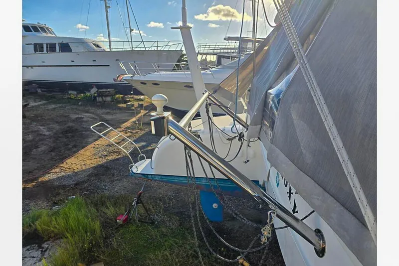 Slide: The Image of Docked Dolphin 460 sailboat from 2006, with other boats in the background. - 58