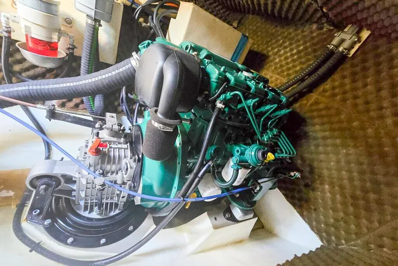 Slide: The Image of Engine compartment of a 2006 Dolphin 460, showcasing mechanical components and wiring. - 61