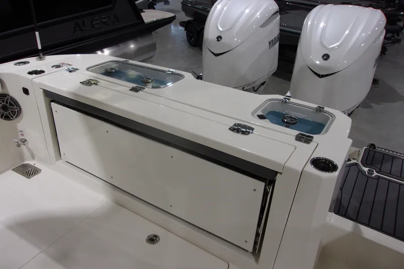 Slide: The Image of 2026 Cobia 305 Center Console boat with dual Yamaha engines and livewell. - 10