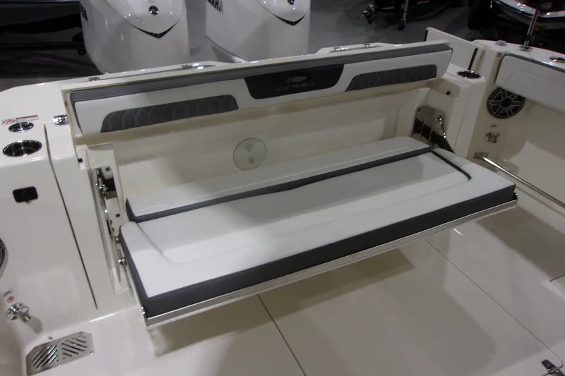 Slide: The Image of 2026 Cobia 305 Center Console boat with foldable seating and sleek design. - 11
