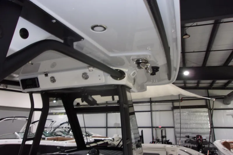 Slide: The Image of 2026 Cobia 305 Center Console boat interior, showcasing overhead console and sleek design. - 20