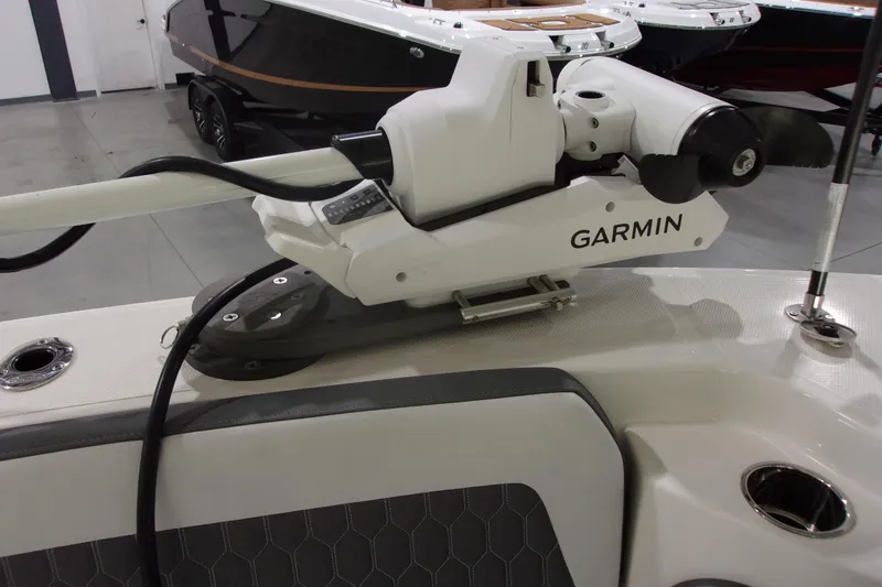 Slide: The Image of 2026 Cobia 305 Center Console with Garmin marine equipment in showroom. - 22