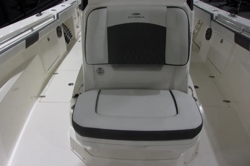 Slide: The Image of 2026 Cobia 305 Center Console boat interior with cushioned seating. - 23