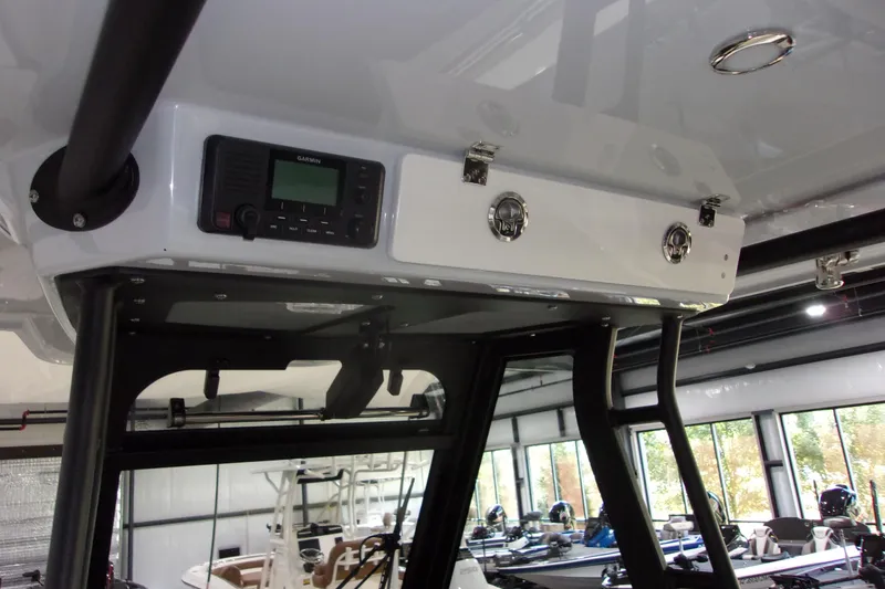 Slide: The Image of 2026 Cobia 305 Center Console boat interior with Garmin electronics. - 5