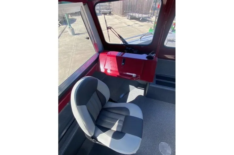 Slide: The Image of Interior of 2023 Spartan 200 Astoria boat with a gray and black seat. - 6