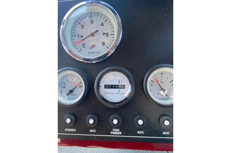 Slide: The Image of Dashboard of 2023 Spartan 200 Astoria with RPM, trim, engine hours, and fuel gauges. - 7