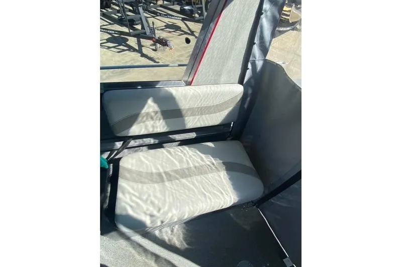 Slide: The Image of 2023 Spartan 200 Astoria interior seat with sunlight reflections. - 8