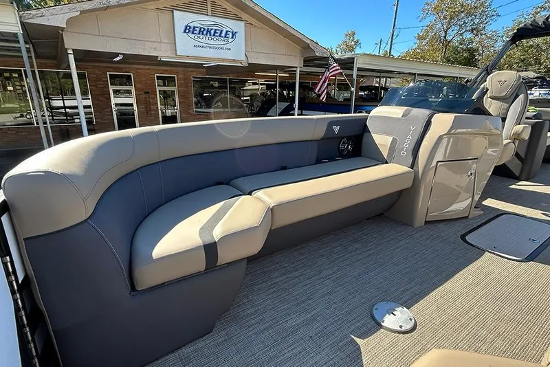 Slide: The Image of 2025 Viaggio Lago X-Q boat interior with beige seating at Berkeley Outdoors dealership. - 16