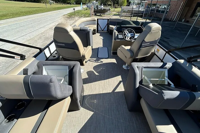 Slide: The Image of 2025 Viaggio Lago X-Q boat interior with luxurious seating and modern steering console. - 23