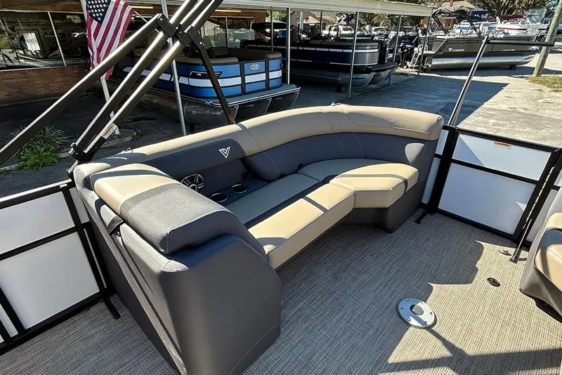 Slide: The Image of Viaggio Lago X-Q 2025 pontoon boat interior with plush seating and modern design. - 26