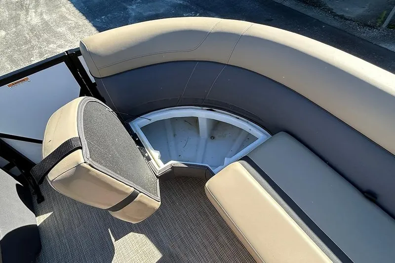 Slide: The Image of 2025 Viaggio Lago X-Q boat interior with open storage compartment and cushioned seating. - 41