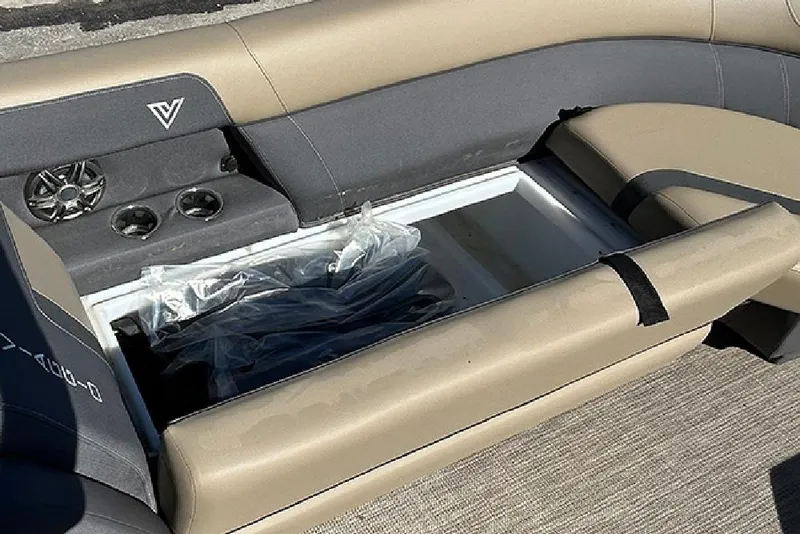 Slide: The Image of Viaggio Lago X-Q 2025 boat interior with open storage compartment and cup holders. - 43