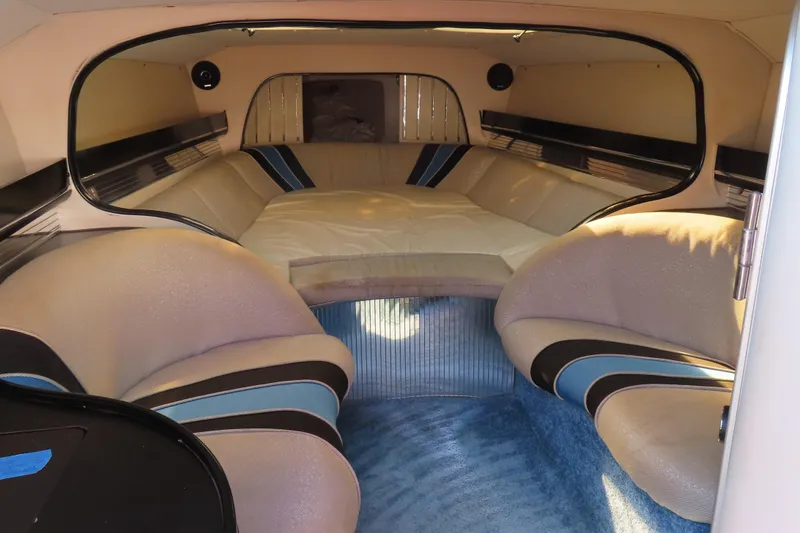Slide: The Image of Interior of a 1990 Wellcraft 38 Scarab boat, featuring plush seating and stylish design. - 21