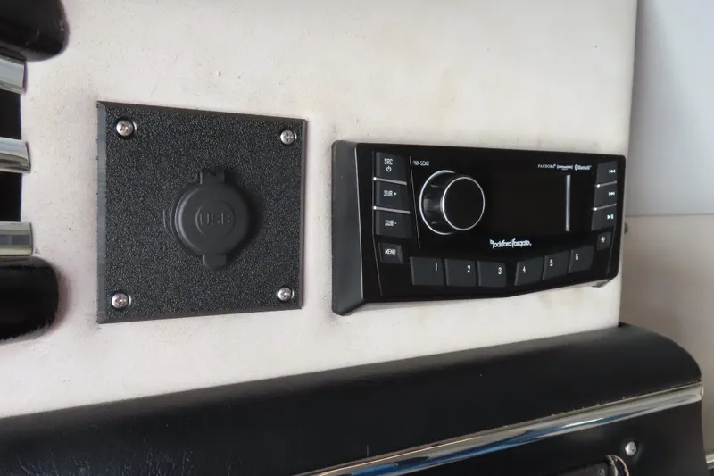 Slide: The Image of 1990 Wellcraft 38 Scarab dashboard with USB port and Rockford Fosgate stereo system. - 23