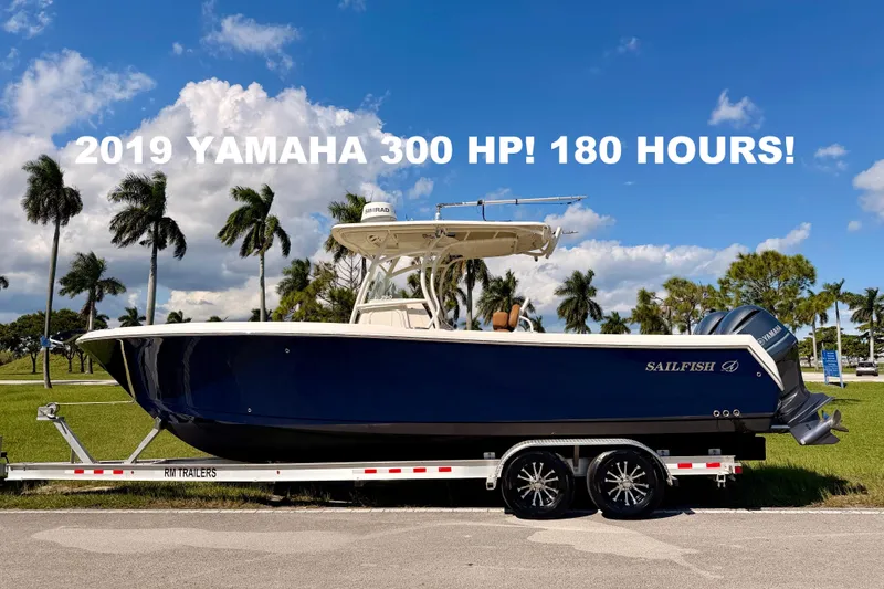 The Image of 2015 Sailfish 290 CC boat with 2019 Yamaha 300 HP engine, 180 hours, on trailer. - 0