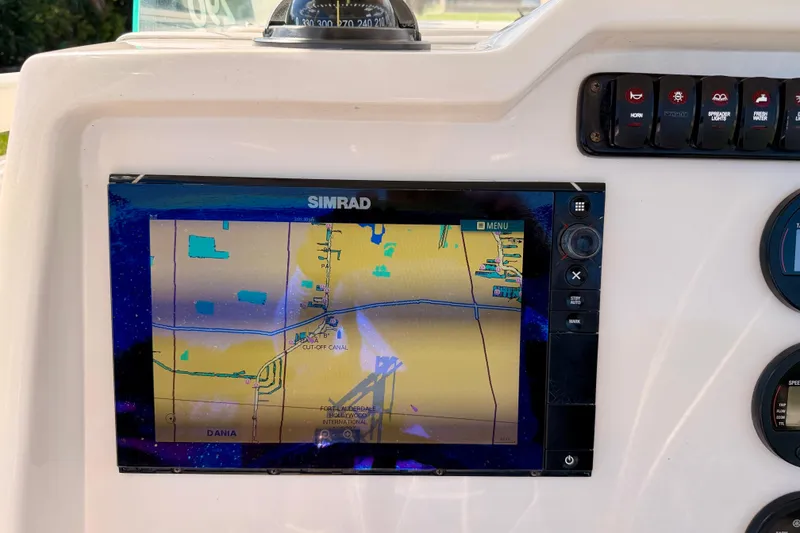Slide: The Image of Simrad navigation display on 2015 Sailfish 290 CC boat dashboard. - 18