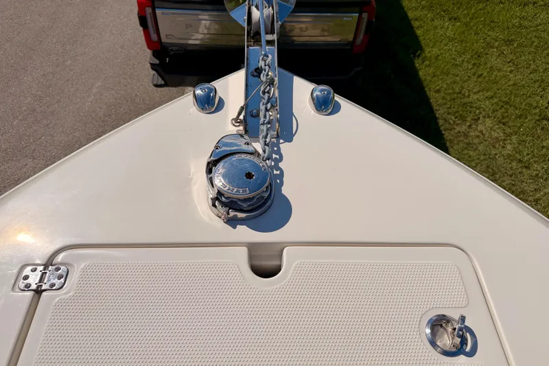 Slide: The Image of Bow of 2015 Sailfish 290 CC boat with anchor chain and hatch. - 41