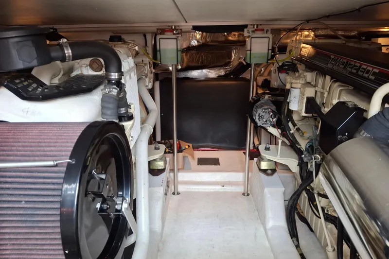 Slide: The Image of Engine room of 2000 Riviera Enclosed Flybridge yacht, showcasing detailed machinery components. - 29