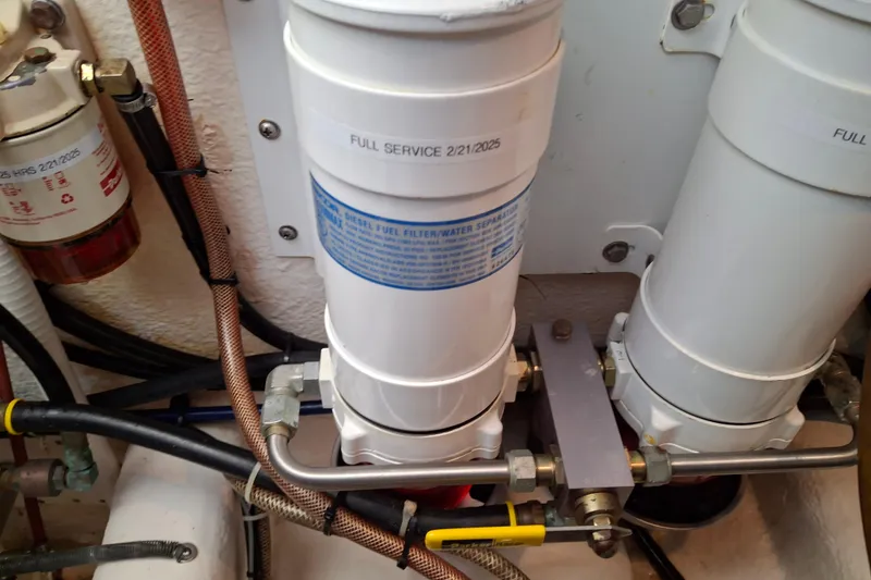 Slide: The Image of Fuel filter system in a 2000 Riviera Enclosed Flybridge yacht engine room. - 34