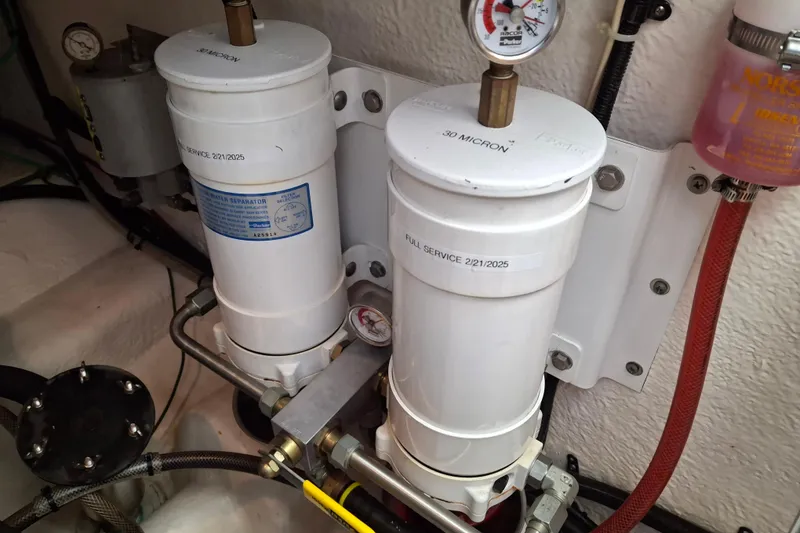 Slide: The Image of Riviera 2000 Enclosed Flybridge interior with ladder and hatch view. - 35