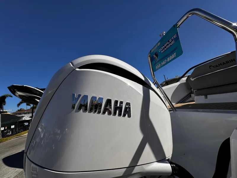 Slide: The Image of Yamarin 80DC 2025 boat with Yamaha engine, sunny day, outdoor display. - 22