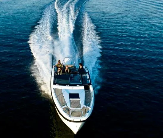 Slide: The Image of 2025 Yamarin 80DC boat cruising on open water with passengers. - 27