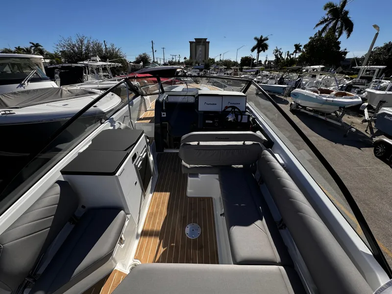 Slide: The Image of 2025 Yamarin 80DC boat interior with sleek seating and modern dashboard. - 3