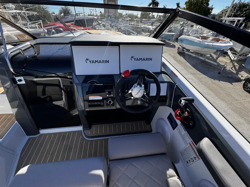 Slide: The Image of 2025 Yamarin 80DC boat cockpit with modern steering and controls. - 4