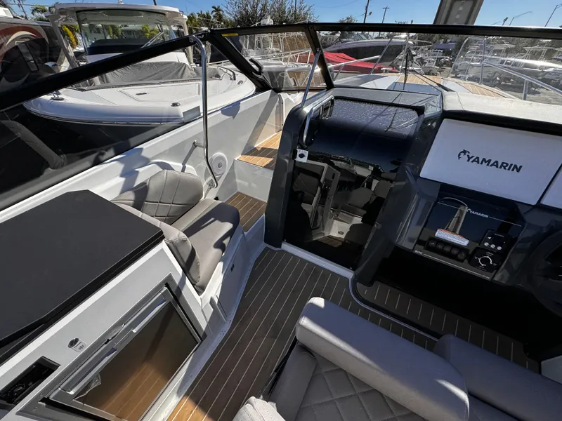 Slide: The Image of Interior of 2025 Yamarin 80DC boat with modern seating and dashboard. - 5