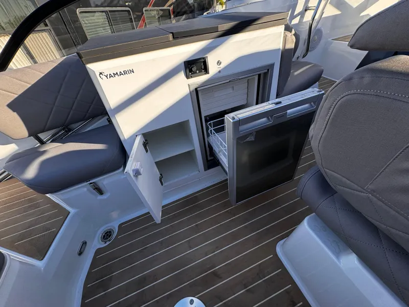 Slide: The Image of Interior of 2025 Yamarin 80DC boat with open storage and seating. - 7