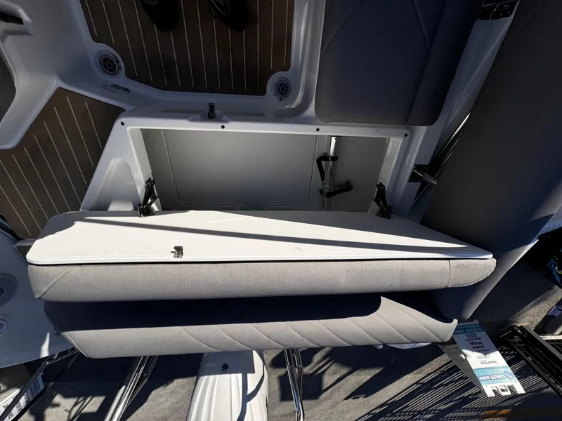 Slide: The Image of Yamarin 80DC 2025 boat interior storage compartment with cushioned seating. - 9